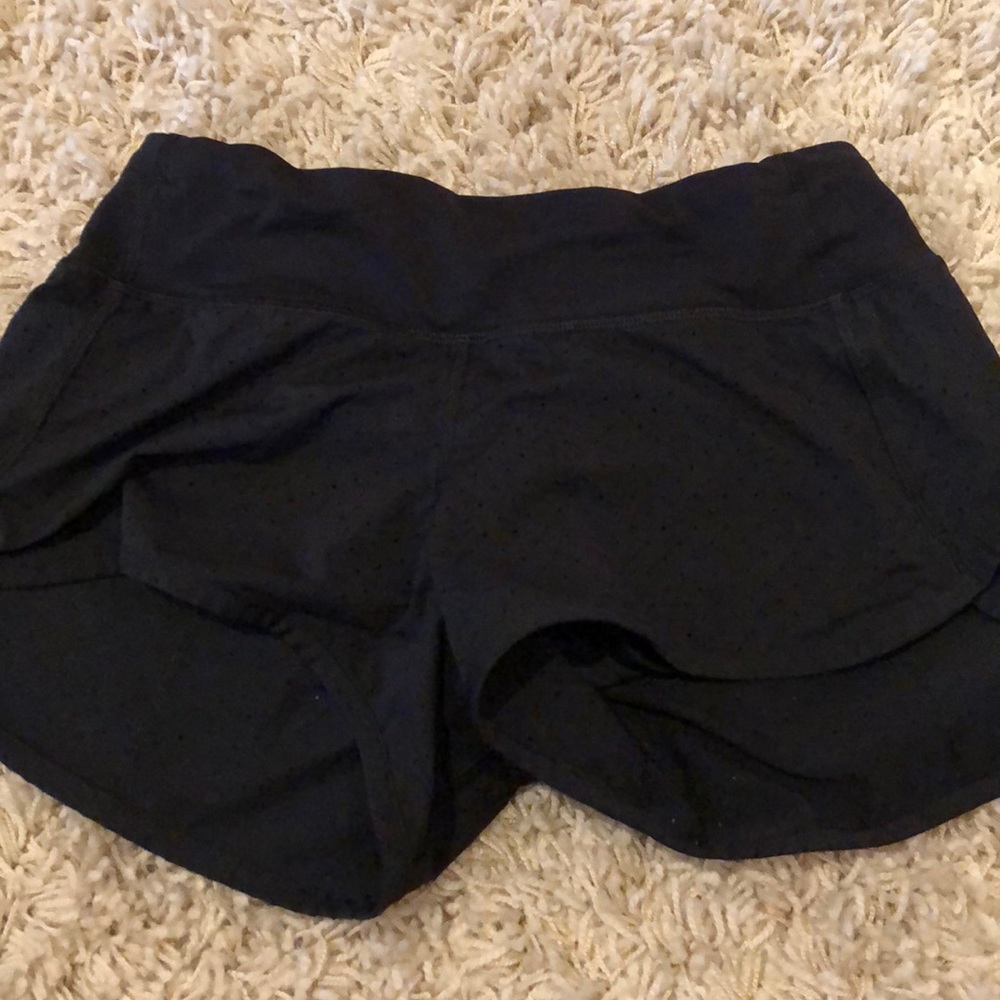 black lulu shorts size two w small hole details